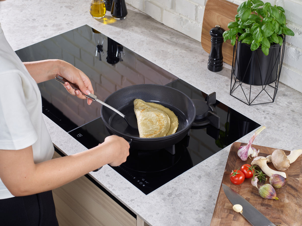 Make an omelet in the Fissler Ceratal® Comfort Frying Pan, Orbitschwarz, 28 cm, with fresh ingredients and premium German design close at hand.