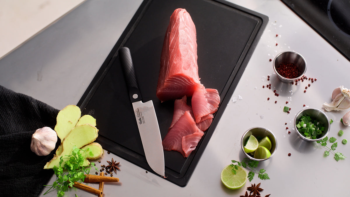 Fissler ProCut 17cm Santoku Knife with Fresh Tuna, Lime, Herbs, Ginger, Spices - Precision in Action.