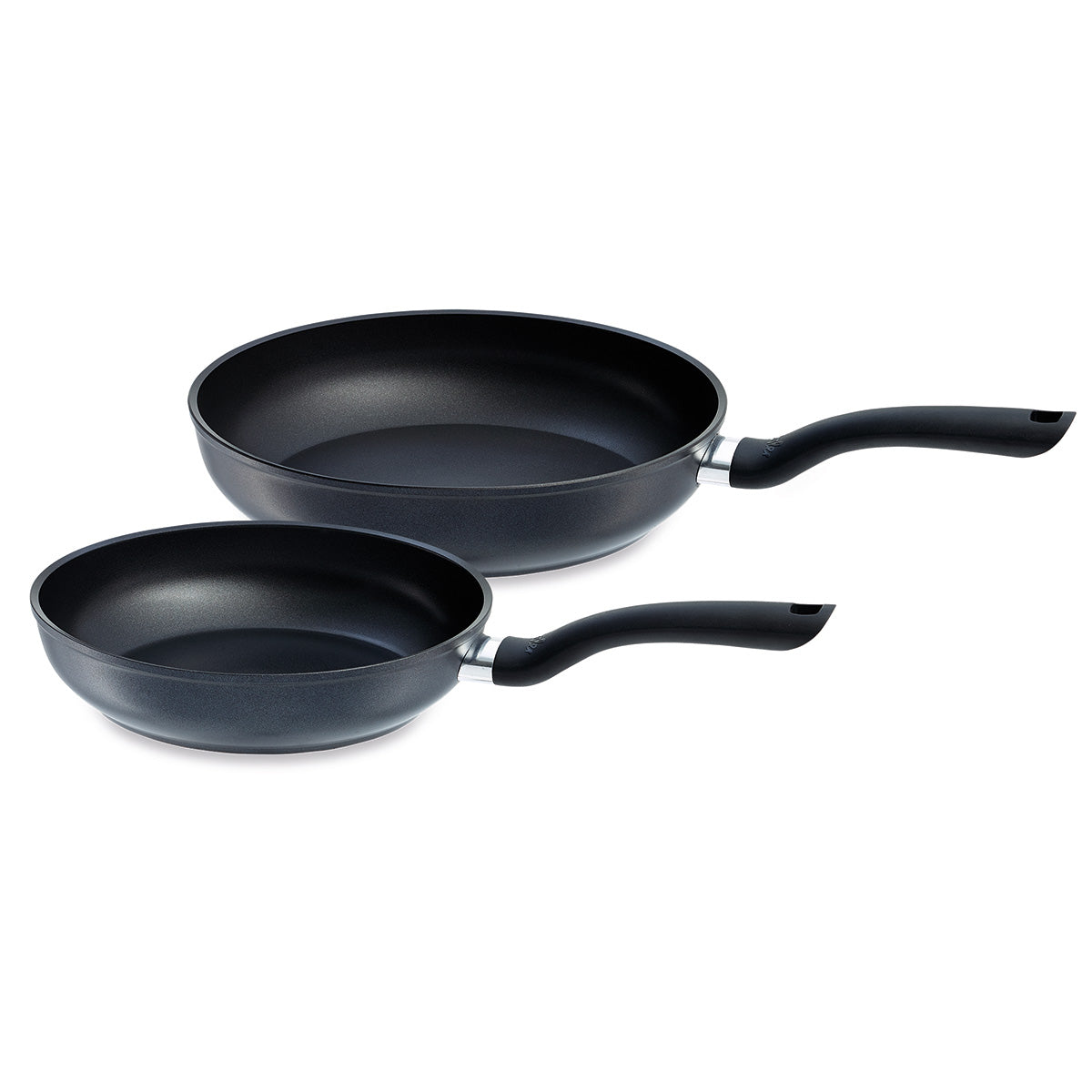 Two premium black nonstick frying pans from the Fissler Cenit® 2-piece Induction Pan Set (24 cm & 28 cm)—one large, one small—are elegantly positioned side by side on a white background. Engineered with Fissler’s signature high-quality nonstick coating and ergonomically curved handles, these German-made pans exemplify precision, innovation, and durability for effortless cooking and easy cleaning. Ideal for induction cooktops and all stovetops, a reflection of Fissler’s heritage in timeless kitchen design